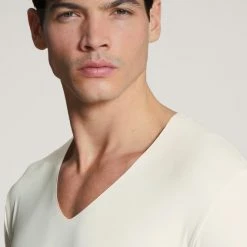 Calida 100% Nature T-Shirt Mit Clean Cut, V-Neck, Compostable 11 Calida 100% Nature T-Shirt Mit Clean Cut, V-Neck, Compostable -CALIDA shop Calida 100 Nature T Shirt V Neck weiss 14080 910 1622638791